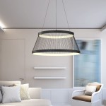 Lampa wisząca Balu 2xLED/57W w kolorze czarnym piaskowym, o cylindrycznym kształcie, zawieszona na cienkich linkach. Wnętrze lampy wykończone jest białym akrylem, co zapewnia równomierne oświetlenie. Produkt umieszczony we wnętrzu z jasnymi meblami.