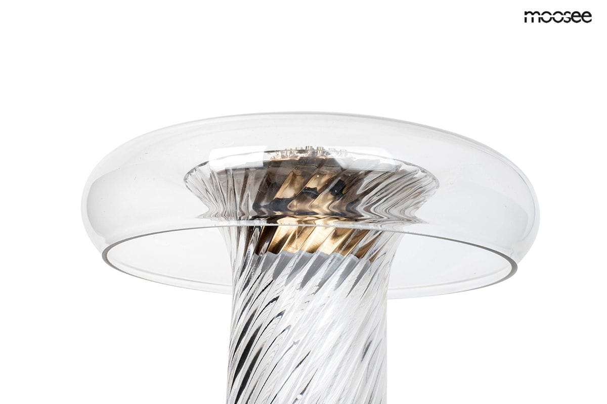 Lampa stołowa Icar z jedną diodą LED, z przezroczystym kloszem i złotym wykończeniem. Ujęcie z góry, ukazujące spiralny kształt podstawy oraz detale konstrukcji. W tle białe, jednolite tło.