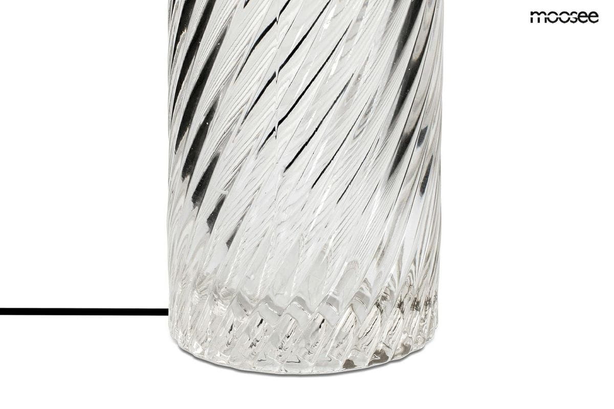 Lampa stołowa Icar w kolorze złotym i przeźroczystym, wykonana z teksturowanego szkła z falistym wzorem. Ujęcie w zbliżeniu na dolną część lampy, ukazujące detale faktury i kształtu. Baza lampy jest okrągła i stabilna.