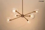 Lampa wisząca Aura w kolorze złotym, z sześcioma miejscami na żarówki E14, z metalowym stelażem i transparentnymi kloszami w kształcie kul. Produkt zawieszony w centralnej pozycji, z widocznymi żarówkami. Tło jasne, minimalistyczne.