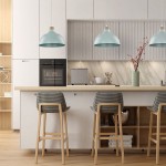 Lampa wisząca Cap w kolorze miętowym z mocowaniem E27, z zaokrąglonym kloszem i drewnianym detalem, zawieszona nad wyspą kuchenną. W tle nowoczesna kuchnia z białymi meblami, drewnianym blatem i stylowymi krzesłami.
