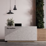 Lampa wisząca Jump w kolorze czarnym, z jednym gniazdem E27, o stożkowym kształcie. Zawieszona nad recepcją, w aranżacji wnętrza z zielonymi roślinami i betonowym blatem. Widoczny minimalistyczny design.