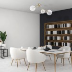 Lampa sufitowa Fairy 3xG9 w kolorze złotym i transparentnym, zawieszona na trzech ramionach, z przezroczystymi kloszami. Produkt umieszczony w nowoczesnym wnętrzu z białym stołem i krzesłami. Tło proste, w neutralnych kolorach.