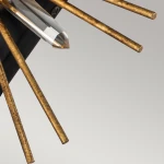 Kinkiet Sun King 1xE14 w kolorze starego złota z przezroczystym kryształem na środku. Produkt ma promieniste, metalowe ramiona, montowany na ścianie, z widocznym detalem kryształu na tle jednolitym.