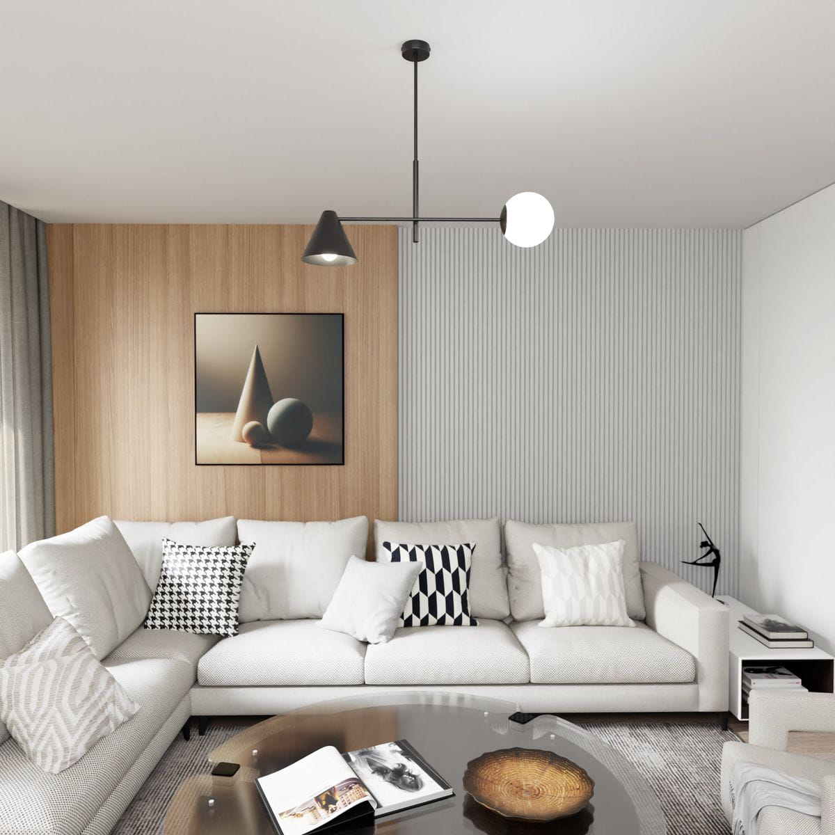 Lampa wisząca Hermes w kolorze czarnym, z jednym źródłem światła E27 i jednym E14. Posiada geometryczny kształt z czarnym kloszem i białą kulą. Zawieszona sufitowo nad sofą w nowoczesnym wnętrzu.