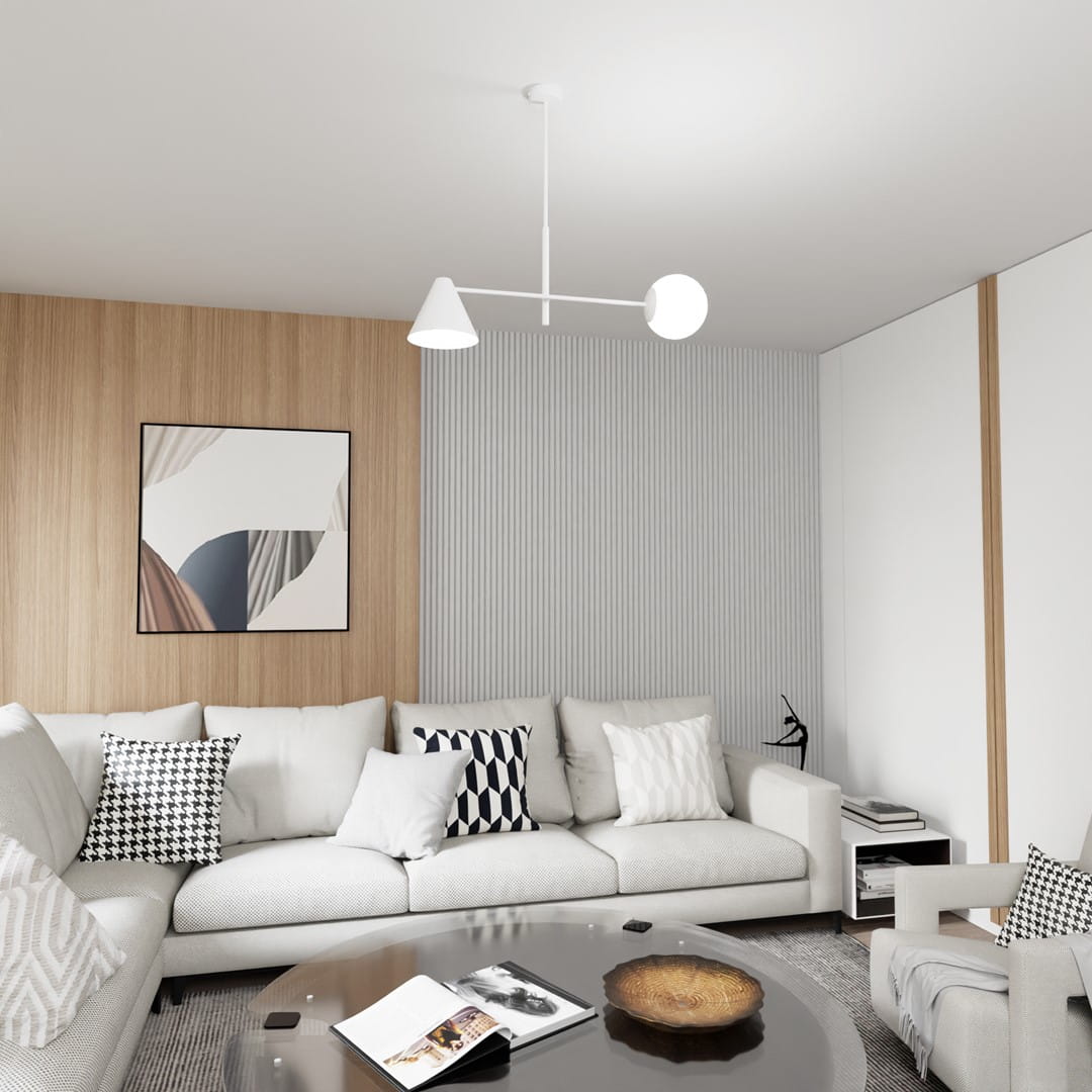 Lampa wisząca Hermes w białym kolorze z dwoma źródłami światła, zawieszona w nowoczesnym wnętrzu. Kształt geometryczny: stożek i kula. Produkt znajduje się nad sofą, w tle widoczne drewniane panele i jasne ściany.