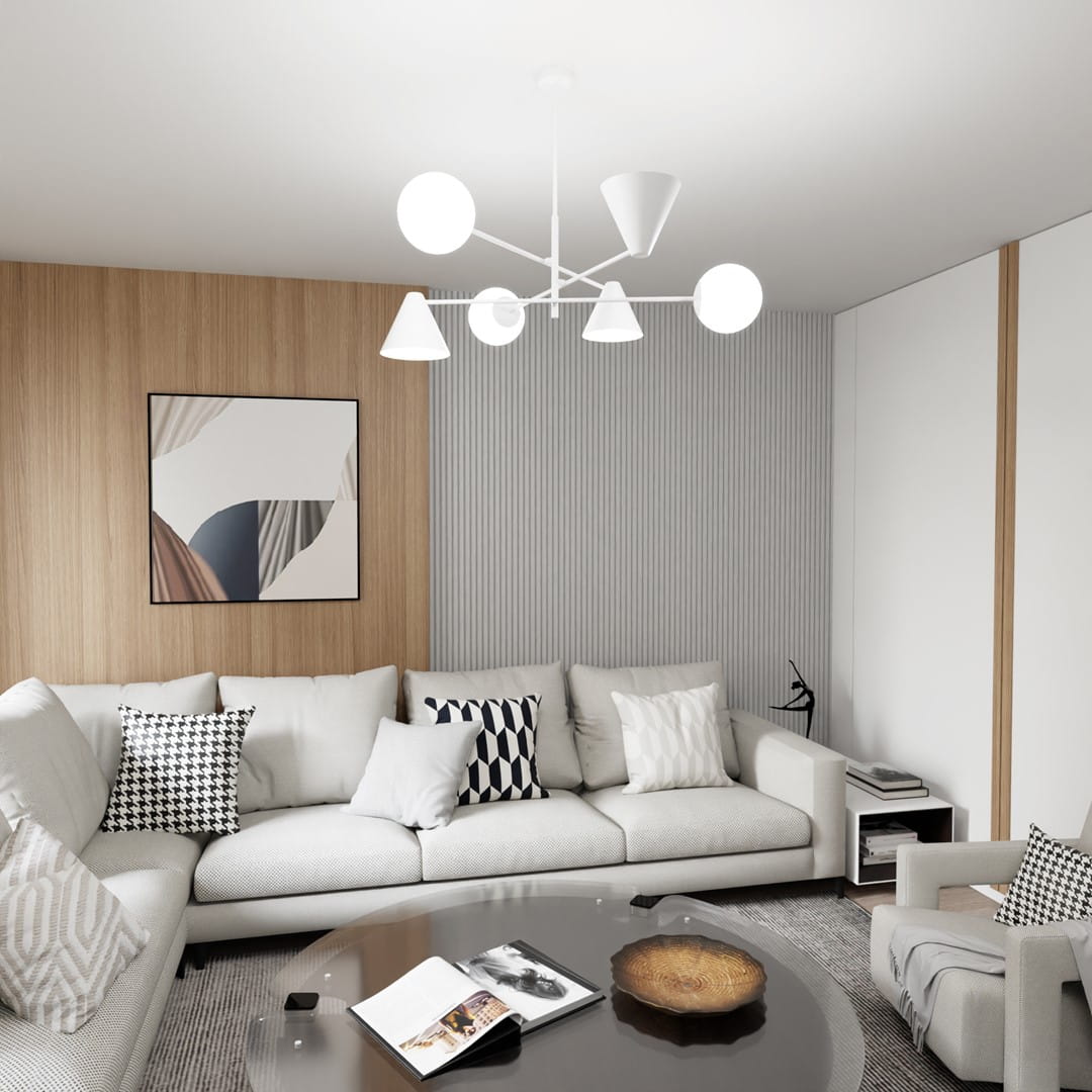 Lampa wisząca Hermes z trzema kloszami w kształcie stożków i kul, w białym kolorze, zawieszona w nowoczesnym wnętrzu. Klosze rozmieszczone asymetrycznie, tworzą harmonijną kompozycję nad okrągłym stołem. Tło z drewnianą ścianą i białymi panelami.