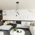 Lampa wisząca Elit 3xGX53 w kolorze czarnym, z trzema zwisającymi kloszami w kształcie stożków, zamontowana na okrągłym stropie. Widoczna w nowoczesnym wnętrzu z jasną sofą i marmurowym stołem. Tło to elegancka ściana z wzorem marmuru.