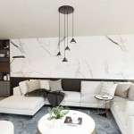 Lampa wisząca Elit w kolorze czarnym z czterema kloszami GX53, zawieszona na długich kablach. Zainstalowana w nowoczesnym wnętrzu z jasnymi sofami i marmurową ścianą, tworzy elegancką atmosferę.