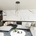 Lampa wisząca Elit 4xGX53 w kolorze czarnym i złotym, z czterema stożkowymi kloszami, zawieszona na długich linkach. Produkt umieszczony w nowoczesnym wnętrzu z marmurową ścianą, obok jasnej sofy i stylowego stolika.