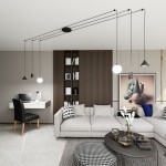 Czarna lampa wisząca Fuji z sześcioma źródłami światła E14/GU10/GX53, zamontowana na długich przewodach. W tle nowoczesny salon z szarym narożnikiem, biurkiem i regałem oraz dekoracyjnym obrazem.