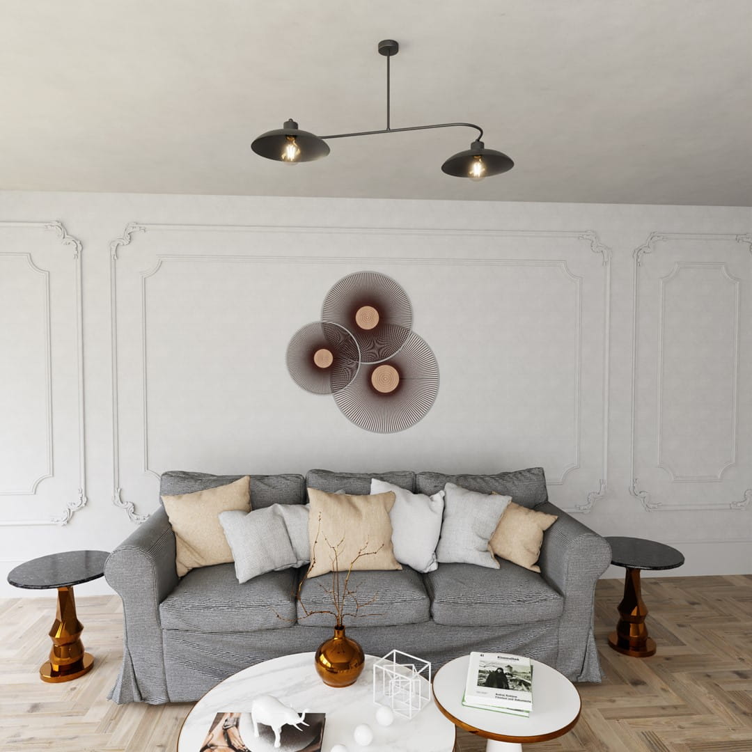 Czarna lampa wisząca Foster z dwoma oprawami E27, zawieszona na cienkim, metalowym ramieniu. Lampa ma industrialny design, z okrągłymi kloszami, w otoczeniu nowoczesnego salonu z szaro-beżową sofą i dekoracjami.