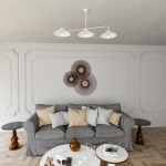 Lampa wisząca Foster w kolorze białym, z trzema kloszami E27. Umieszczona na białym suficie nad szaro-beżową sofą, w nowoczesnym wnętrzu. Klosze mają okrągły, płaski kształt, a ich wnętrze jest w kolorze miedzi.
