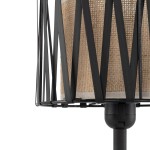 Lampka stołowa Harmony z czarnym metalowym stelażem i brązowym abażurem z naturalnego materiału. Ujęcie z boku, ukazujące geometryczną konstrukcję oraz detal materiału. Idealna do aranżacji wnętrz. Wysokość podstawy i zamontowane gniazdo E27.
