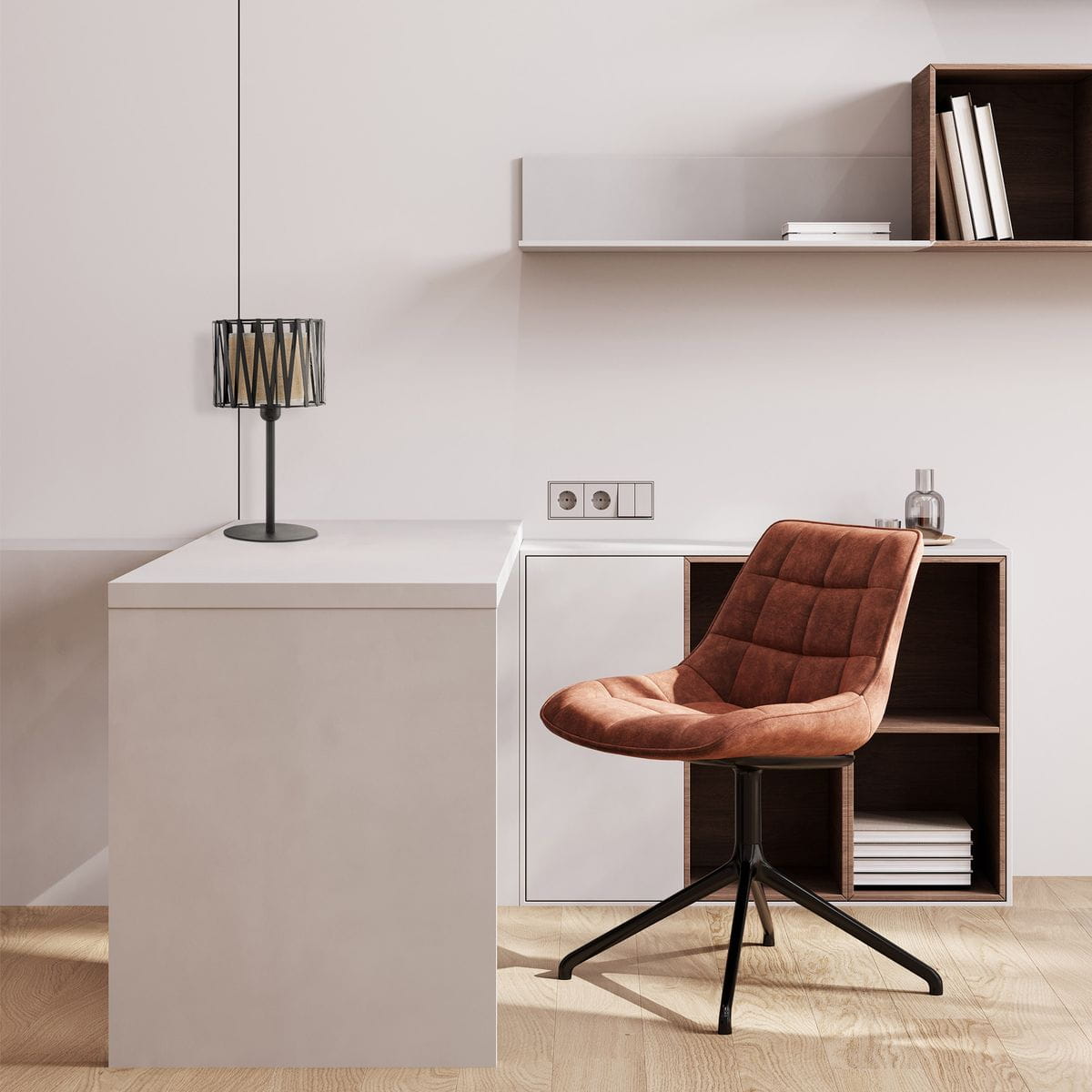 Lampka stołowa Harmony 1xE27 w kolorze czarnym i brązowym, z metalowym kloszem w geometrycznym kształcie, umieszczona na białym blacie. W tle widoczna brązowa, tapicerowana krzesło oraz minimalistyczne półki z książkami.