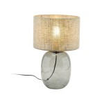 Lampa stołowa Melody z grafitowym, szklanym korpusem i beżowym abażurem z tekstury. Ujęcie z boku, stojąca, z widocznym kablem. Idealna do nowoczesnych wnętrz, z możliwością użycia żarówki E27.