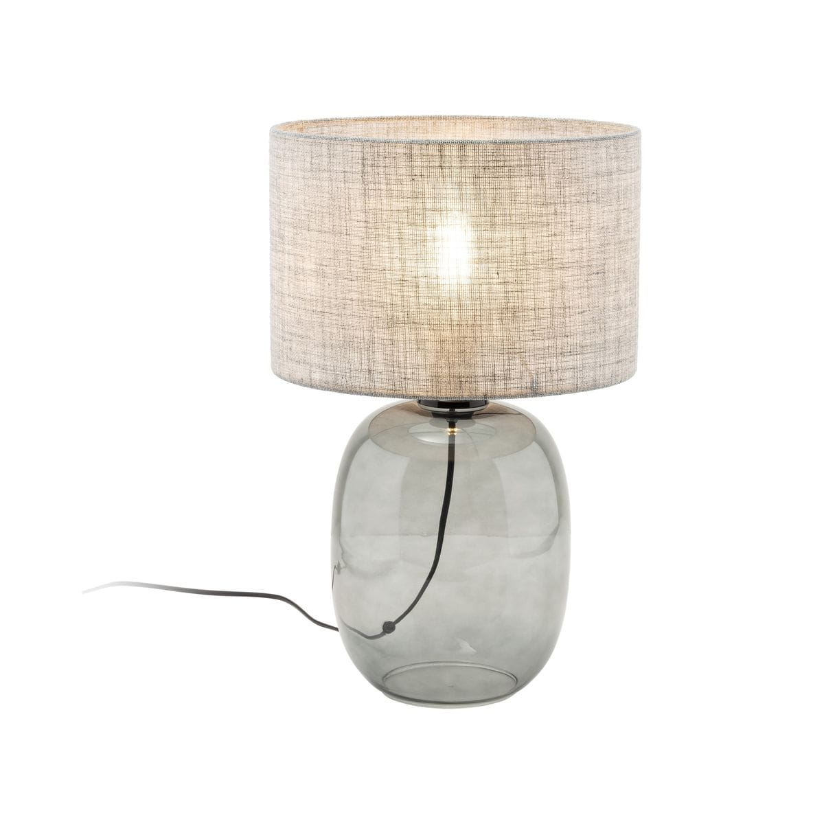 Lampa stołowa Melody z grafitowym, szklanym podstawą w kształcie elipsy oraz szarym, tekstylnym kloszem. Produkt ukazany z boku, z widocznym kablem zasilającym. Wymiary klosza nie są podane.