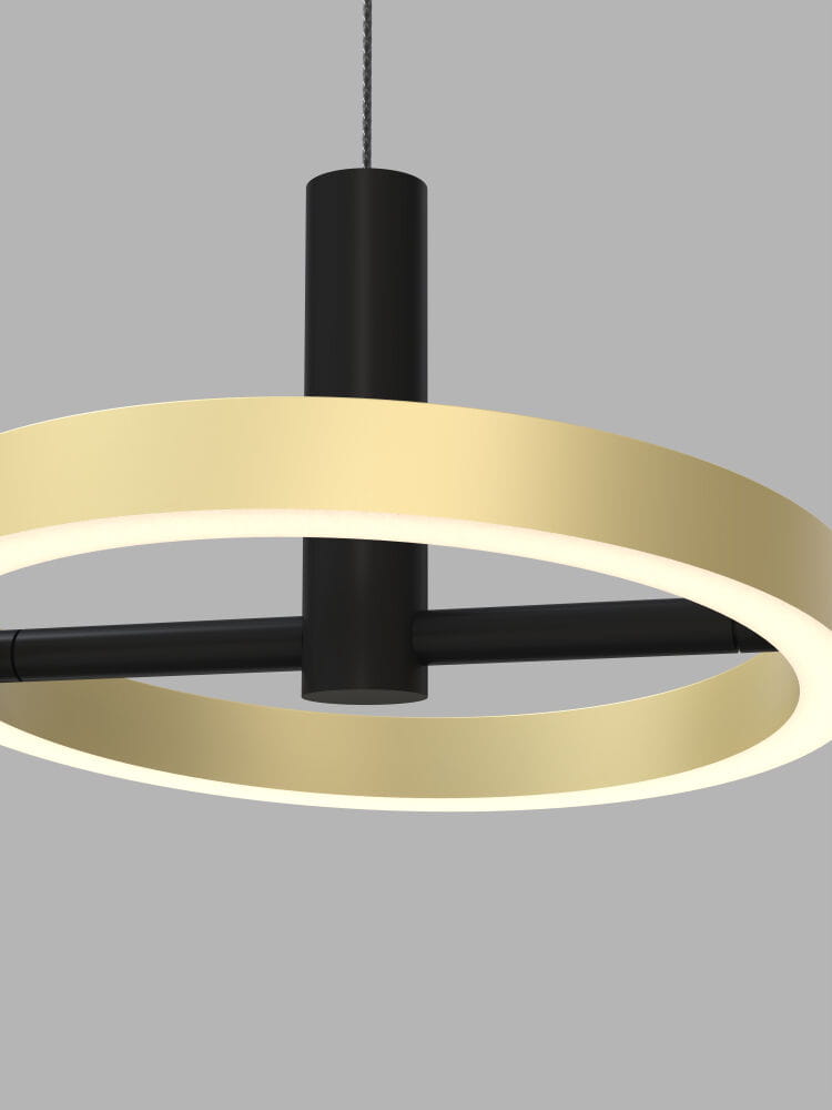Lampa wisząca Brest z trzema źródłami LED, o mocy 21W, w kolorze czarnym z złotym akcentem. Okrągła forma z metalowym mocowaniem, zawieszona na cienkim przewodzie, na szarym tle. Idealna do nowoczesnych wnętrz.