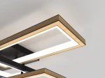 Lampa sufitowa Matera 5xLED/60W w kolorze czarnym z drewnianymi detalami. Widok z dołu, pokazujący prostokątne ramy z białym podświetleniem. Elementy metalowe i drewniane tworzą nowoczesny design.