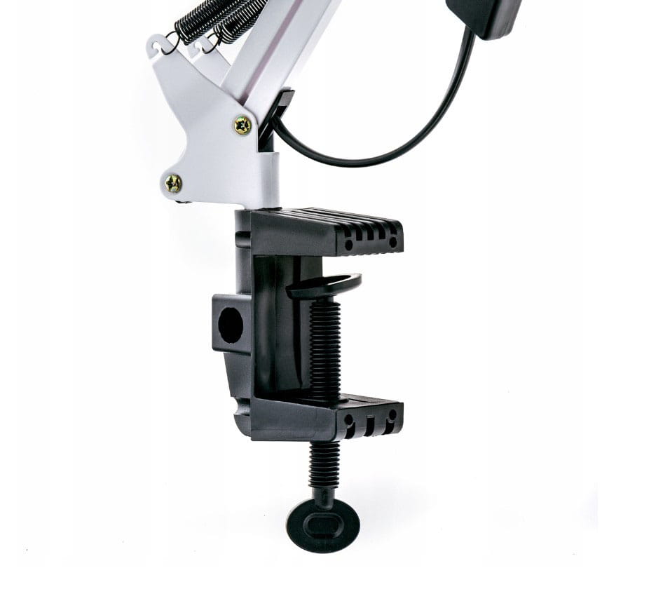 Uchwyt do stołu lampki biurkowej Lena, w kolorze białym, z regulowanym ramieniem. Widać czarną, mocną podstawę z zaciskiem oraz sprężynę, która zapewnia stabilność. Elementy wykonane z metalu i tworzywa sztucznego.