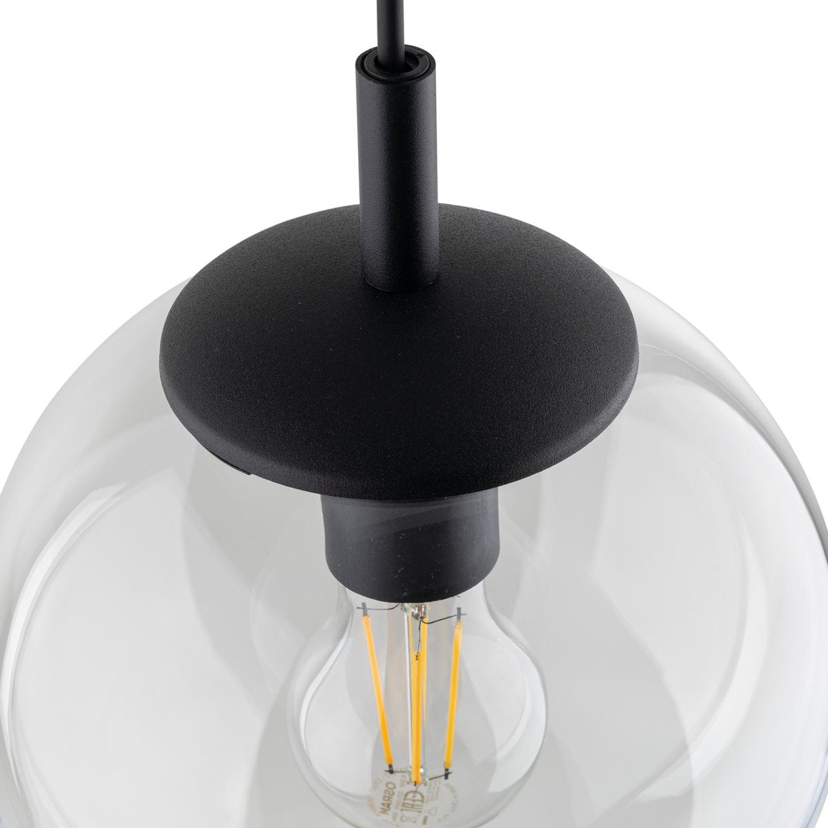 Lampa wisząca Esme D30 z czarnym metalowym mocowaniem i przezroczystym kloszem. Widoczny gwint E27 z żarówką o widocznych włóknach. Kąt ujęcia z góry, ukazujący detal konstrukcji.
