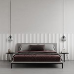 Lampa wisząca Vibe D20 w kolorze czarnym i grafitowym, z oprawą na żarówkę E27. Zawieszona nad łóżkiem w nowoczesnej sypialni, obok znajdują się minimalistyczne stoliki nocne. Tło w jasnych odcieniach z dekoracyjnymi panelami.