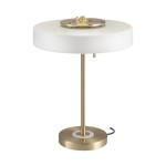 Lampa stołowa Artdeco z trzema gniazdami E14, wykonana z szczotkowanego złotego metalu z białym kloszem. Stojąca, z okrągłą podstawą i prostym designem, idealna do nowoczesnych wnętrz. Widoczny kabel zasilający.