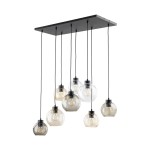 Lampa wisząca Cubus z 8 kloszami E27 w różnych kolorach, zawieszona na czarnej podstawie. Klosze mają różne kształty: okrągłe i owalne, wykonane z przezroczystego i lekko przyciemnionego szkła. Kabelki czarne, wiszące w różnych długościach.