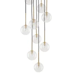 Lampa wisząca Nilos z 10 kulistymi kloszami G9 w kolorze przezroczystym, zawieszona na czarnych przewodach. Klosze są umieszczone na złotych rurkach, wiszących w różnych długościach, tworząc efektowną kompozycję.