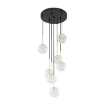 Lampa wisząca Nilos z siedmioma przezroczystymi kloszami w kształcie kul, zawieszona na czarnych przewodach z metalowymi elementami w kolorze złotym. Montaż sufitowy, nowoczesny design.