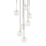 Lampa wisząca Nilos z siedmioma kulistymi kloszami, wykonanymi z przezroczystego szkła, zawieszona na czarnych przewodach. Klosze osadzone na złotych, metalowych uchwytach, w różnych długościach. Idealna do nowoczesnych wnętrz.