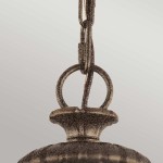 Lampa wisząca Adams 3xE14 w antycznym brązie, z okrągłym kloszem i metalowym zawieszeniem. Widoczny detal mocowania z okrągłym pierścieniem, który łączy kabel z lampą. Ujęcie z góry, na jednolitym tle.