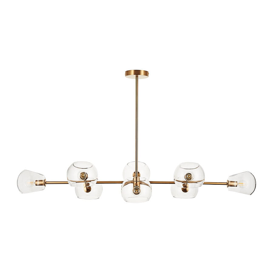 Lampa wisząca Cosmic w kolorze złotym, z ośmioma gniazdami E14, z przezroczystymi kloszami w kształcie kul. Ujęcie frontalne, produkt zamontowany na suficie, z centralnym wspornikiem oraz czterema kloszami umieszczonymi po bokach.