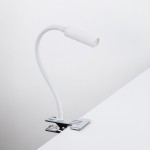 Lagos kinkiet z klipsem 1xG9 w kolorze białym i chromowanym, z elastycznym ramieniem, zamontowany na blacie. Lampa ma minimalistyczny design, z cylindryczną głowicą oświetleniową i metalowym uchwytem.