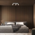 Lampa sufitowa Jet z trzema reflektorami GU10, w kolorze białym, zamontowana na drewnianym, poziomym tle. Oświetlenie skierowane w dół, idealne do nowoczesnych wnętrz. W tle widoczna tapicerowana łóżko z poduszkami i pledem.