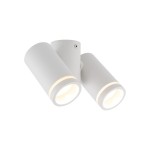 Biała lampa sufitowa z dwoma reflektorami typu GU10, o cylindrycznym kształcie. Reflektory ustawione pod różnymi kątami, montowane na okrągłej podstawie. Prosta, minimalistyczna konstrukcja, idealna do nowoczesnych wnętrz.
