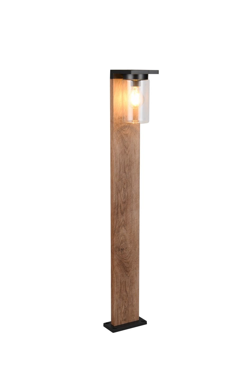 Stojąca lampa ogrodowa Ardila H100 z czujnikiem zmierzchu, wykonana w imitacji drewna. Produkt ma prostokątny kształt, czarny metalowy daszek i przezroczystą osłonę żarówki. Lampa jest umieszczona na kwadratowej podstawie, oświetlona ciepłym światłem.