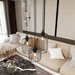 Lampa wisząca Vander 3xE27 w czarnym kolorze z metalowymi kloszami w formie siatki. Zawieszona na trzech linkach, idealna do nowoczesnych wnętrz. Widoczna na tle jasnej kanapy i stołu z marmurowym blatem.