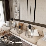 Czarna lampa wisząca Vander 3BL z trzema kloszami w kształcie siatki, zawieszona na cienkich linkach. Widoczna w nowoczesnym wnętrzu z jasną sofą i stolikiem kawowym. Klosze mają gwinty E27, w środku żarówki emitujące ciepłe światło.