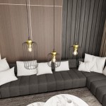 Lampa wisząca Vander 3GL z czarnymi kloszami w metalowej siatce i złotymi detalami, zawieszona nad szarym narożnikiem. W komplecie trzy źródła światła E27, umieszczone w dekoracyjnych oprawach. Tło stanowi drewniana ściana i biała kanapa.