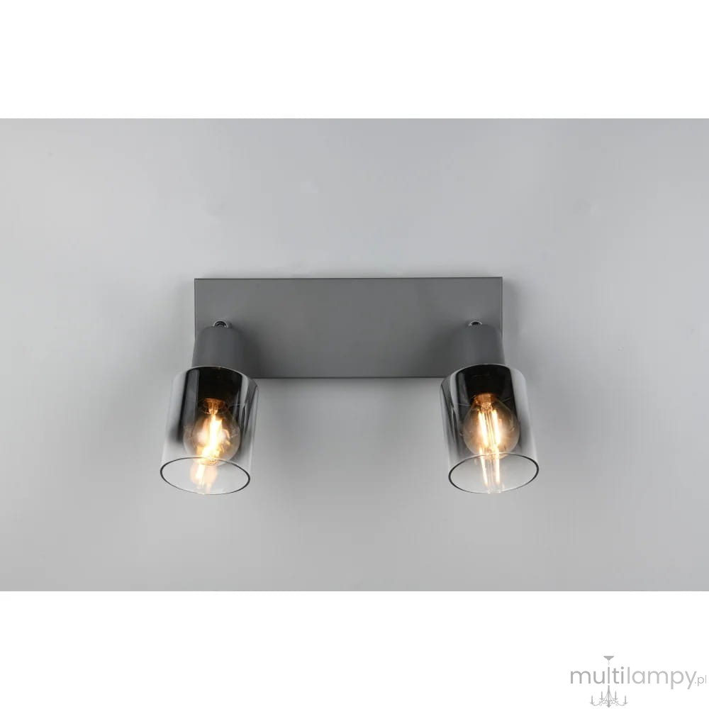 Lampa sufitowa Cadiz z antracytowym metalowym mocowaniem, z dwoma szklanymi kloszami w kolorze przezroczystym. Ujęcie frontalne, pokazujące lampę z zamontowanymi żarówkami E14. Prosty design, idealna do nowoczesnych wnętrz.