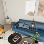 Czarna lampa wisząca Nando 1BL z oprawą na żarówkę E27, w formie okrągłej klatki. Zawieszona na cienkim przewodzie, znajduje się nad niebieską sofą z poduszkami. W tle widoczny stół kawowy z czasopismami i rośliną.