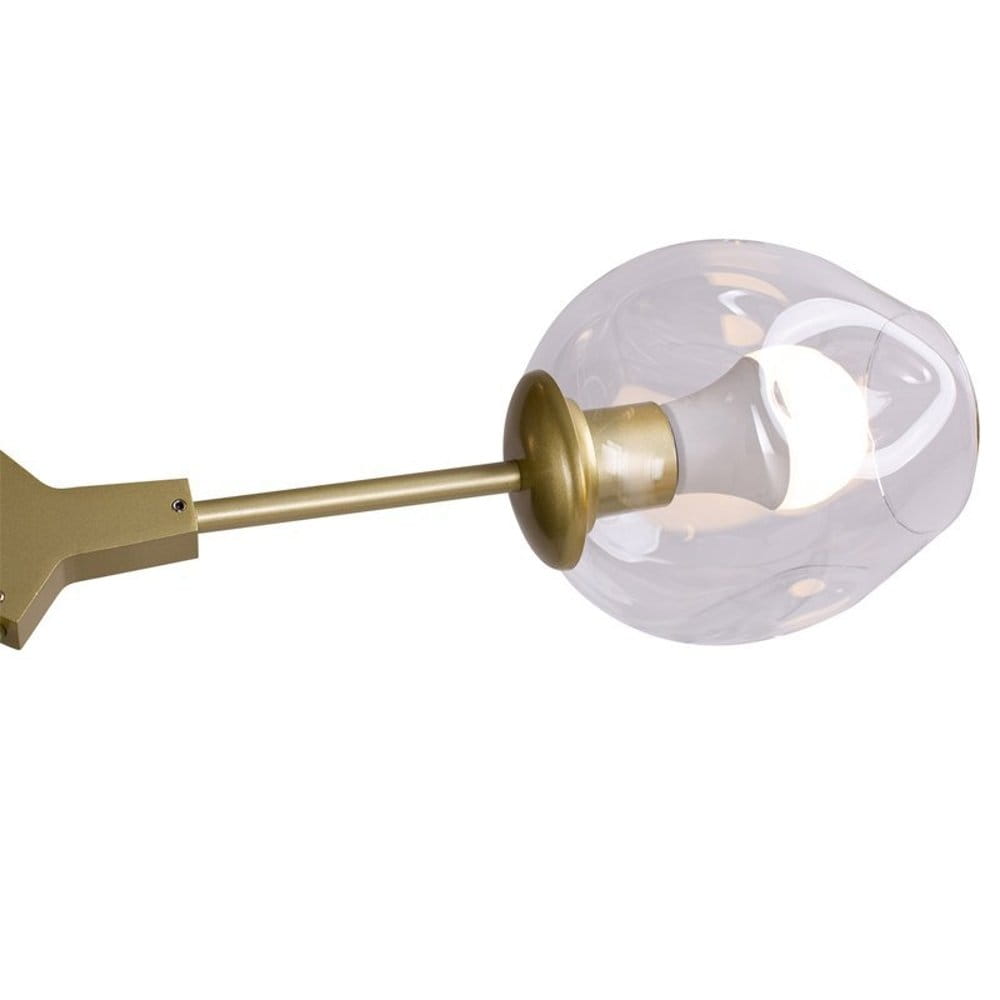 Lampa wisząca Modern Orchid z sześcioma gniazdami E27, złoty metalowy stelaż z przezroczystym kloszem, o okrągłym kształcie. Widok z boku, ukazujący detal mocowania i źródło światła. Elegancka, nowoczesna forma idealna do wnętrz.