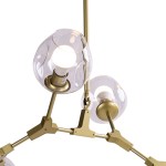 Lampa wisząca Modern Orchid z sześcioma oprawami E27. Złota konstrukcja metalowa z transparentnymi kloszami w kształcie kul. Ujęcie z góry, pokazujące detale mocowania i kształt kloszy. Idealna do nowoczesnych wnętrz.