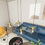 Lampa wisząca Nando 4GL z czarnymi metalowymi kloszami w formie kul oraz złotymi detalami, zawieszona na długich linkach. W tle niebieska sofa i okrągły stół z gazetą, w nowoczesnym wnętrzu o jasnych ścianach.