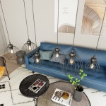 Lampa wisząca Nando 6BL z sześcioma kloszami w formie siatki, czarna, zawieszona nad niebieską kanapą. W tle nowoczesne dekoracje i stół z okrągłym blatem. Idealna do aranżacji wnętrz.