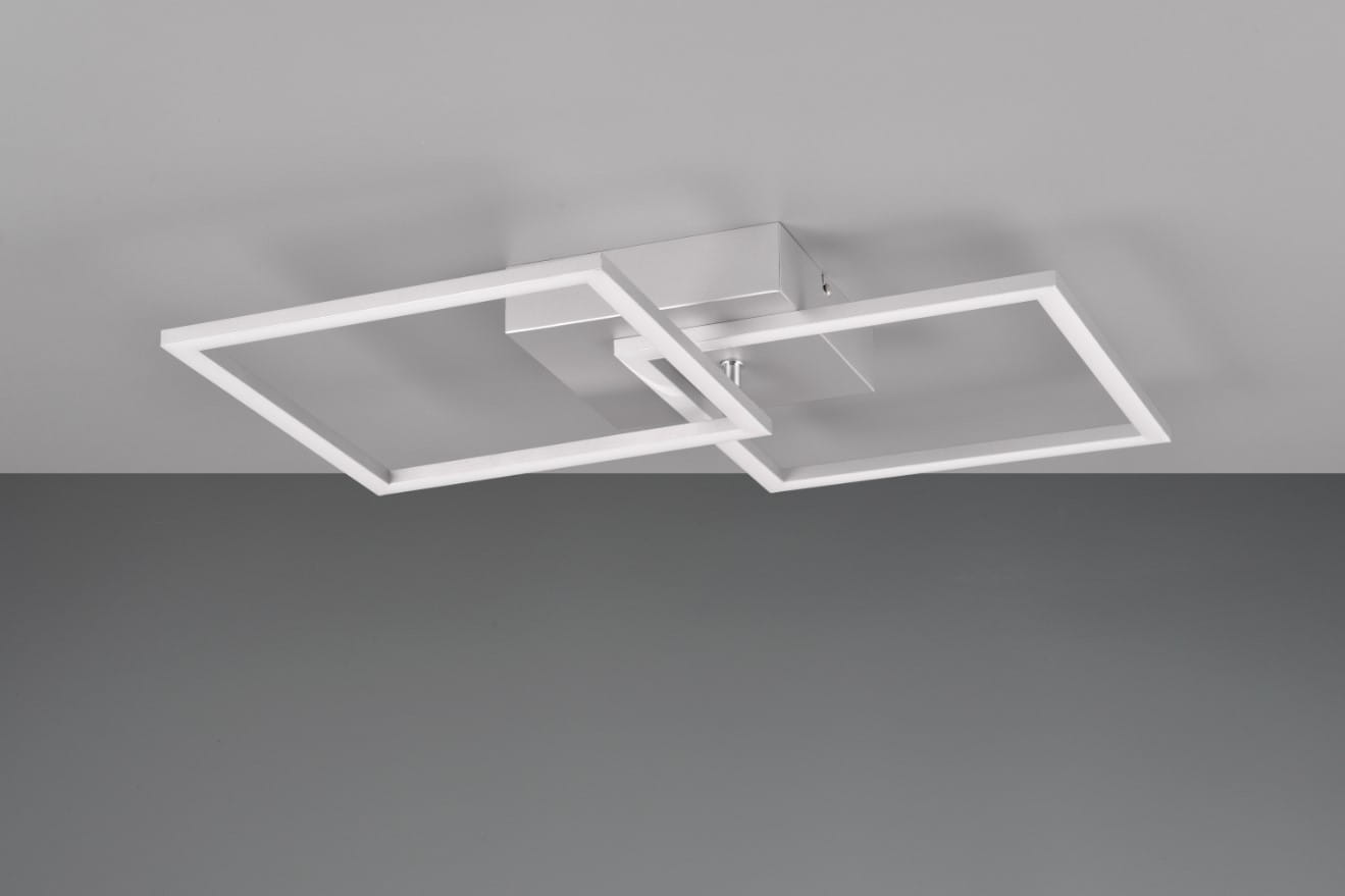 Lampa sufitowa Trail 2xLED/20W w kolorze tytanowym, złożona z dwóch prostokątnych ram w białym kolorze, zamontowana na metalowej podstawie. Ujęcie z dołu, pokazujące unikalny kształt i konstrukcję. Tło w odcieniach szarości.