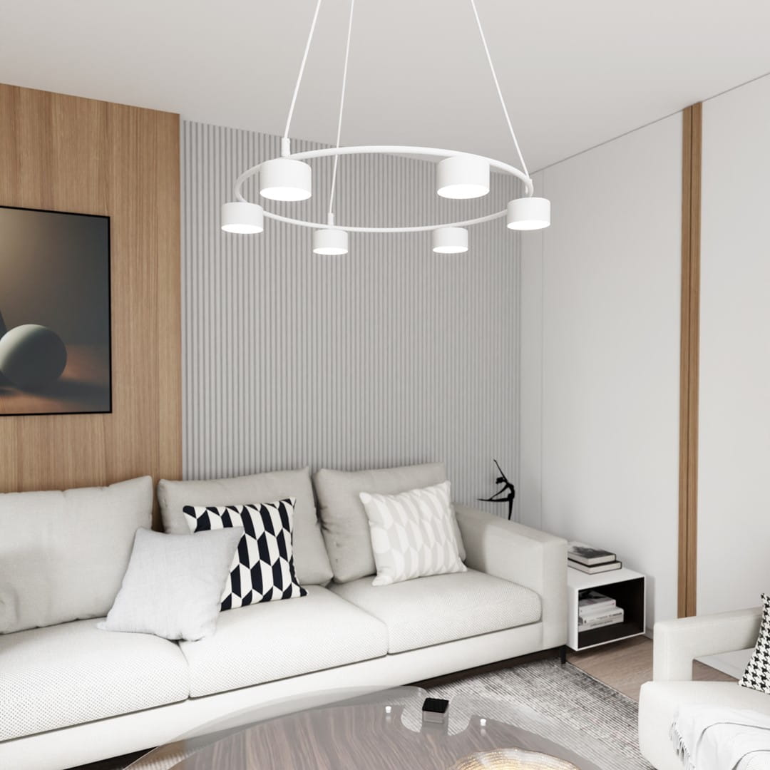 Lampa wisząca Starlit 6xGX53 w kolorze białym, o okrągłym kształcie z sześcioma źródłami światła, zawieszona nad jasną sofą w nowoczesnym wnętrzu. W tle drewniana ściana i elementy dekoracyjne.