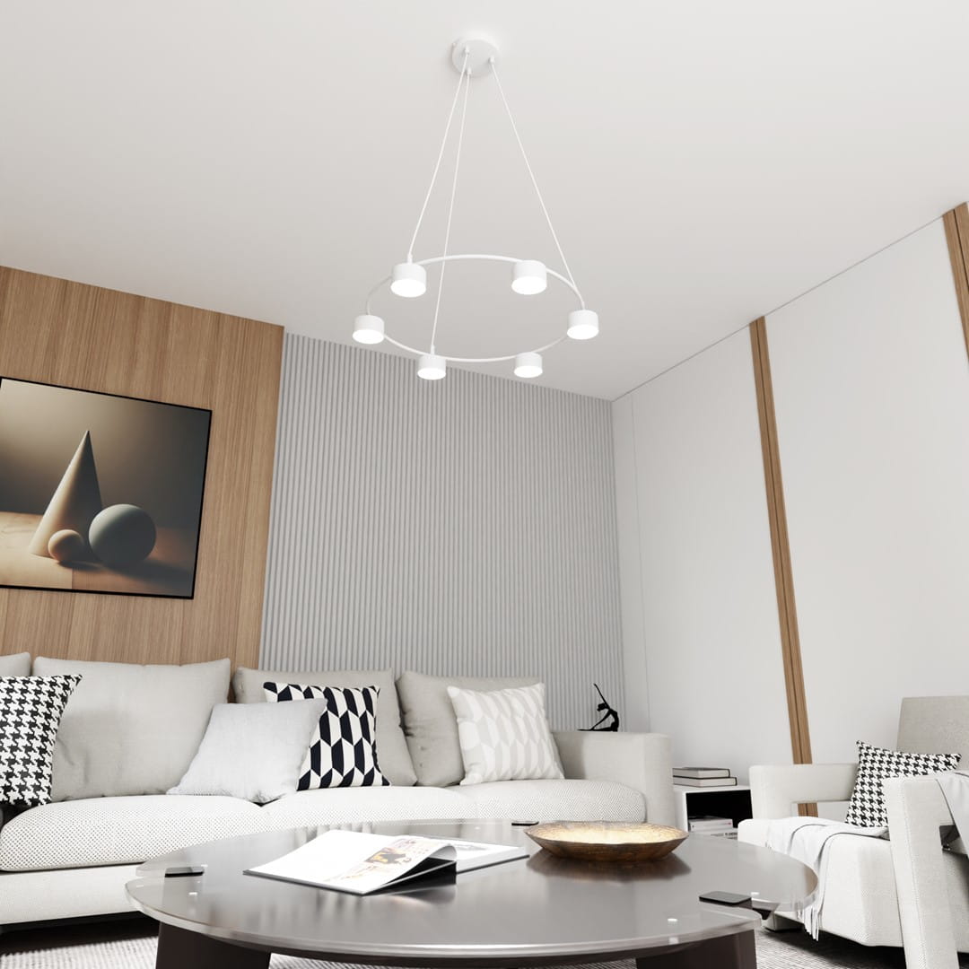 Lampa wisząca Starlit 6xGX53 w kolorze białym, zawieszona na cienkich linkach w okrągłym kształcie, z sześcioma okrągłymi kloszami. Produkt w nowoczesnym wnętrzu, nad okrągłym stolikiem kawowym, na tle jasnej ściany z panelami.