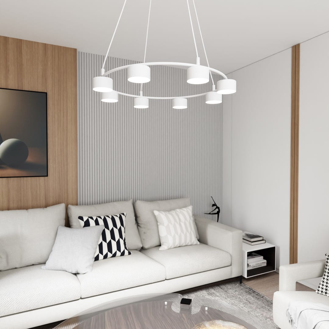 Lampa wisząca Starlit 8xGX53 w kolorze białym, o okrągłym kształcie, zawieszona na trzech linkach. Wnętrze aranżacji z jasną kanapą i poduszkami w geometryczne wzory, na tle drewnianej ściany i minimalistycznych dodatków.